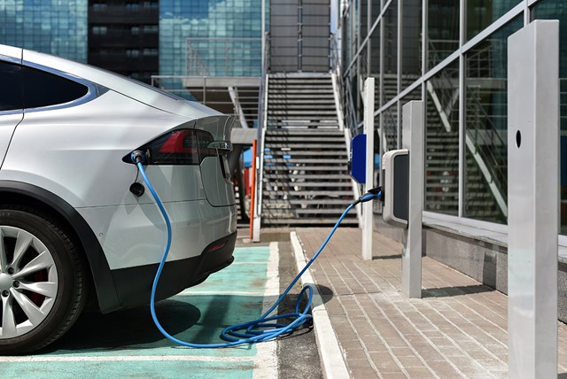 EV plugged into public charge point.