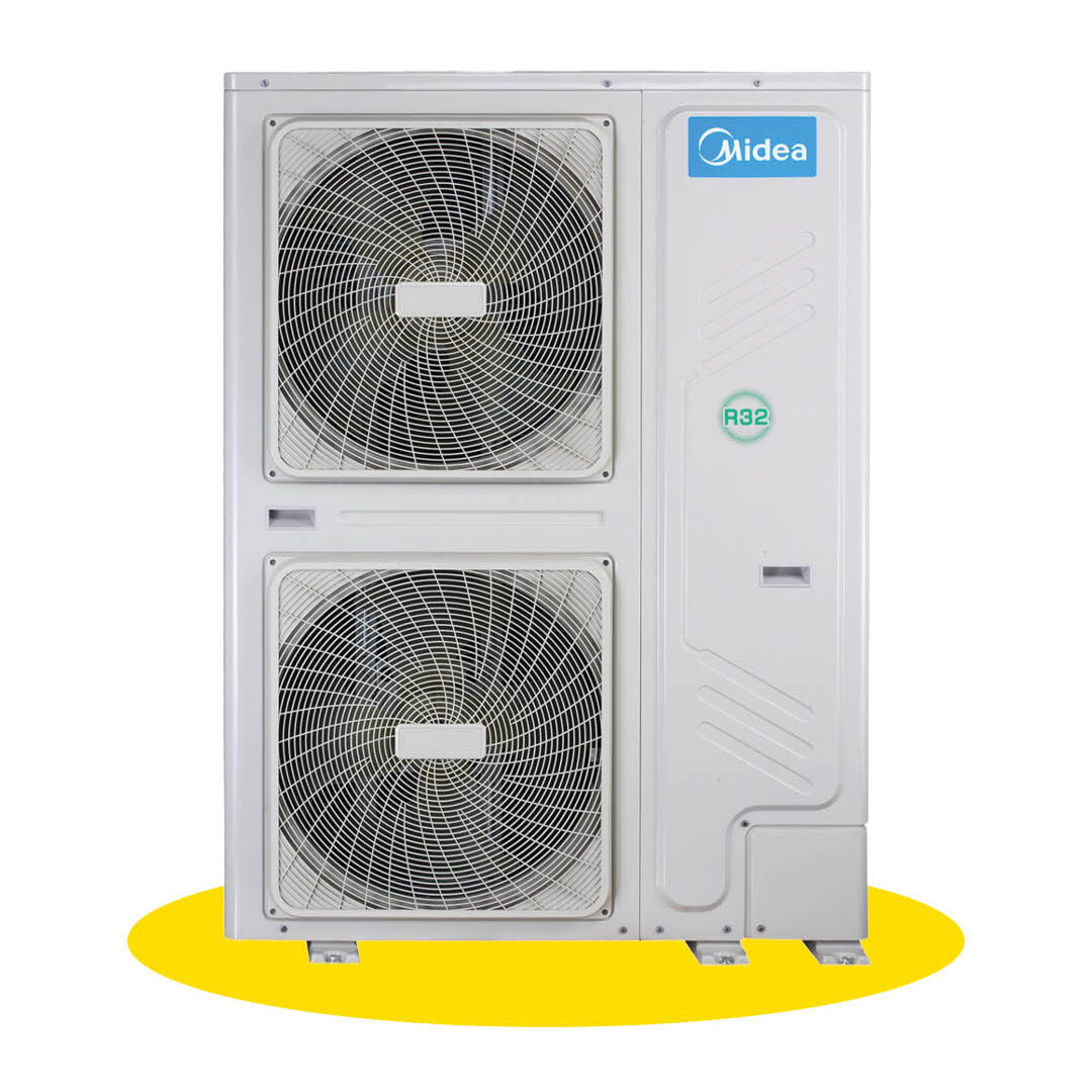 A white outdoor air conditioning unit with two large fans, a blue Midea logo, and an R32 label, standing on a yellow surface.