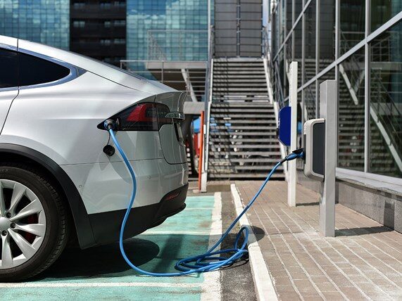 EV plugged into public charge point.