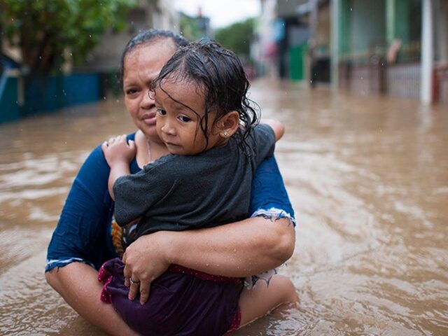 Floods mother and child climate change needed